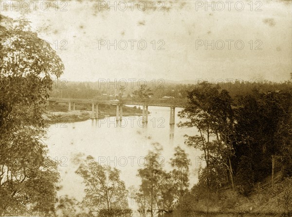 Indooroopilly bridge, Australia. View through trees of the Brisbane river, spanned by the Albert bridge at Indooroopilly. Queensland, Australia, circa 1890., Queensland, Australia, Australia, Oceania.