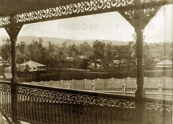 View from the veranda at 'Nundora'. View across neighbouring gardens from the veranda of the Brodribb family's house 'Nundora', taken, according to the original caption, at '5.15'. Toowoomba, Australia, 23 July 1890., Queensland, Australia, Australia, Oceania.