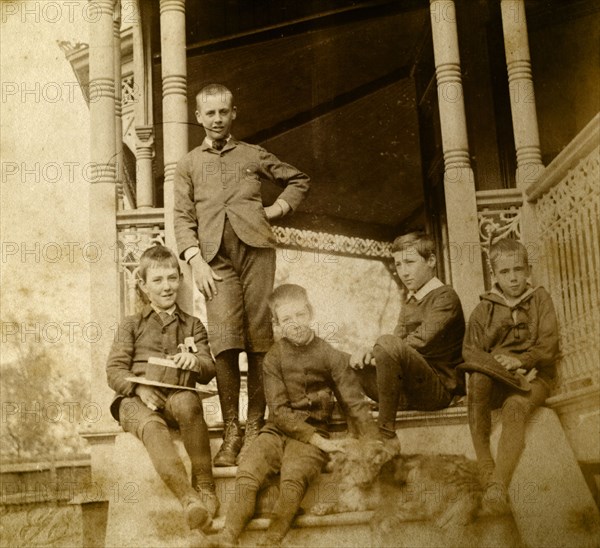 Five boys on the steps at 'Nundora'. Five boys connected with the Brodribb family pose with a dog on the steps of the veranda at 'Nundora', the Brodribb family's house. Toowoomba, Australia, circa 1897. Toowoomba, Queensland, Australia, Australia, Oceania.