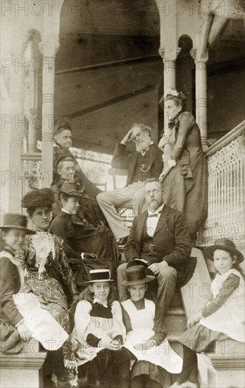 The Brodribbs and the Pughes. Portrait of the Brodribb and Pughe families dressed in their best clothes for the occasion of a christening, on the steps of the Brodribb family home 'Nundora'. Toowoomba, Australia, 22 August circa 1897. Toowoomba, Queensland, Australia, Australia, Oceania.