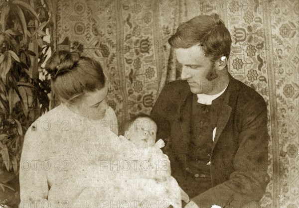 Mr and Mrs Pughe with their baby. Ellen May Pughe and her husband Reverend Thomas St John Parry Pughe look proudly down at their baby, one of their four children born between 1888 and 1897. Near Brisbane, Australia, circa 1895., Queensland, Australia, Australia, Oceania.