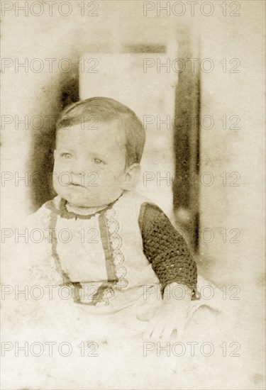 Portrait of a baby, Australia. Portrait of a baby dressed in a pinafore and knitted top aged around one year old. Queensland, Australia, circa 1895., Queensland, Australia, Australia, Oceania.