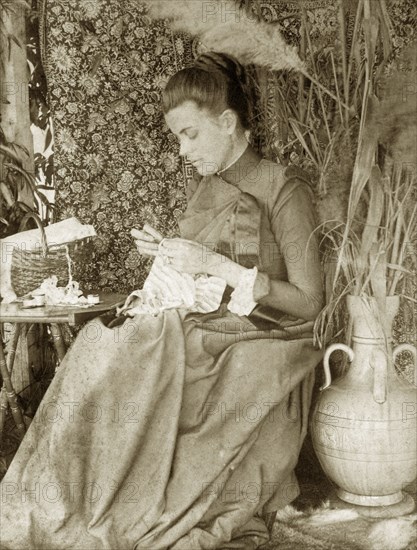 Portrait of Ellen May Pughe, Australia. Outdoors portrait of Ellen May Pughe, nee Brodribb, doing needlework. Near Brisbane, Australia, circa 1895., Queensland, Australia, Australia, Oceania.