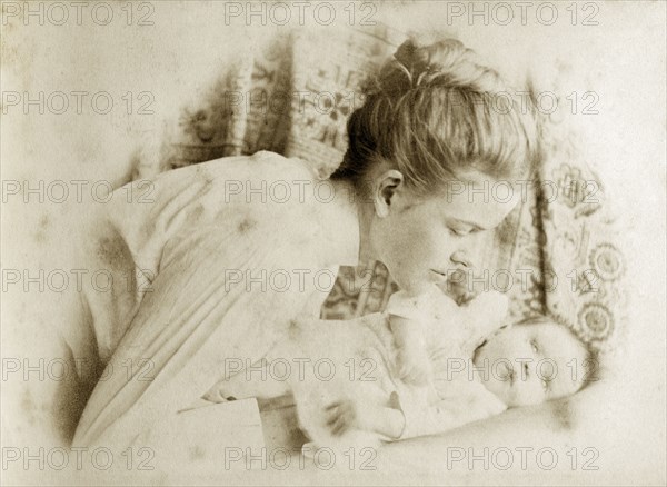 Ellen May Pughe and baby, Australia. Portrait of Ellen May Pughe leaning over her baby, one of her four children born between 1888 and 1897. Near Brisbane, Australia, circa 1895., Queensland, Australia, Australia, Oceania.