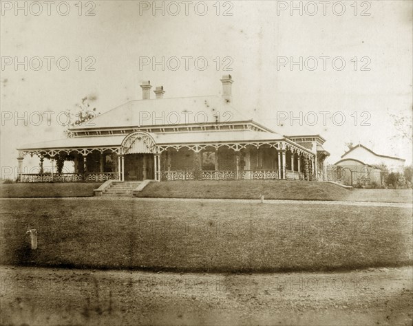 House called 'Wyalla', Australia. Orderly lawns surround 'Wyalla', a large single-storey colonial house with wide verandas and multiple chimneys. Toowoomba, Australia, circa 1905. Brisbane, Queensland, Australia, Australia, Oceania.