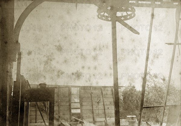 Destruction of a temporary church. View from inside the ruins of a wooden church constructed on a temporary basis for the community of Indooroopilly. The church's stone font can be seen in the wreckage. Indooroopilly, Australia, circa 1890. Indooroopilly, Queensland, Australia, Australia, Oceania.