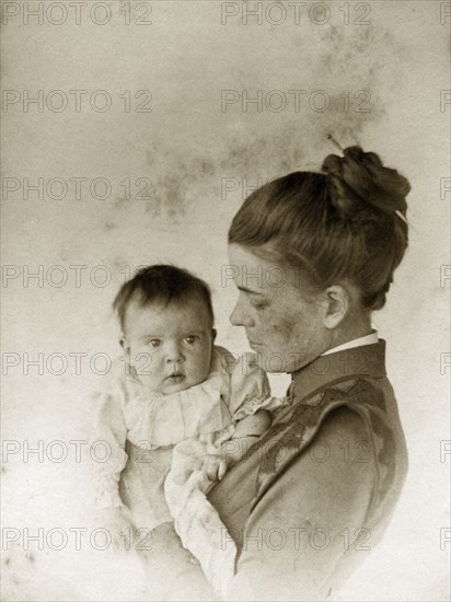 Ellen May Pughe and baby. Portrait of Ellen May Pughe holding her baby, one of her four children born between 1888 and 1897. Near Brisbane, Australia, circa 1895., Queensland, Australia, Australia, Oceania.