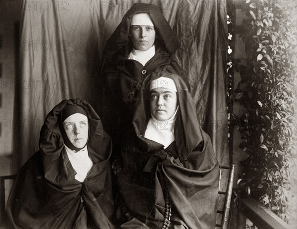 Dressed up as nuns, Australia. Prunella ('Prue') Brodribb, pictured right, and two friends pose for the camera dressed up as nuns. Probably Toowoomba, Australia, circa 1895. Toowoomba, Queensland, Australia, Australia, Oceania.
