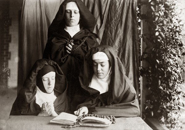 Dressed up as nuns, Australia. Prunella ('Prue') Brodribb, pictured right, and two friends pose for the camera dressed up as nuns. Probably Toowoomba, Australia, circa 1895. Toowoomba, Queensland, Australia, Australia, Oceania.