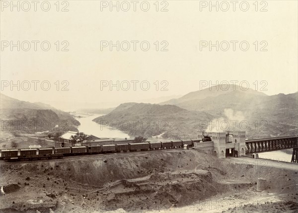 Freight train crossing the Indus River. A freight train crosses the iron girder bridge at Attock over the Indus River. Attock, Punjab, India (Punjab, Pakistan), circa 1895. Attock, Punjab, Pakistan, Southern Asia, Asia.