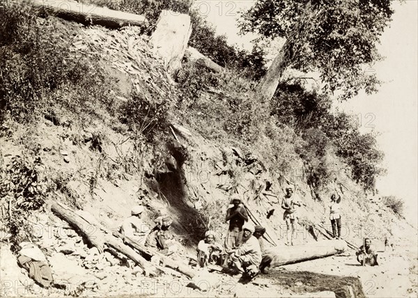 Wood cutters in the Himalayas. A group of wood cutters take a rest from their labours on a hillside in the Himalayan mountains. India, circa 1895., Jammu and Kashmir, India, Southern Asia, Asia.