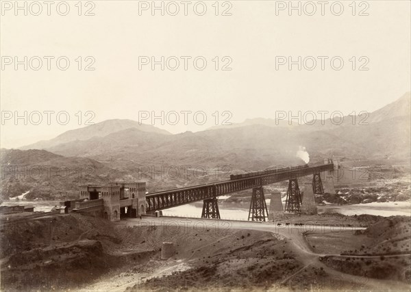 Iron girder bridge at Attock. A freight train crosses the iron girder bridge at Attock over the Indus River. Attock, Punjab, India (Punjab, Pakistan), circa 1895. Attock, Punjab, Pakistan, Southern Asia, Asia.