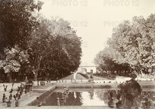 Shalimar Gardens, Lahore. View of the formal Shalimar Gardens at Lahore. Long lines of trees and potted plants flank the edges of a series of shallow canals fitted with fountain heads. Lahore, Punjab, India (Punjab, Pakistan), circa 1895. Lahore, Punjab, Pakistan, Southern Asia, Asia.