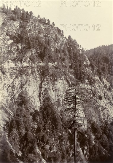 Hill road beyond Murree. A road cut into the sheer face of a Himalayan mountain close to the town of Murree, is barely visible as a pale horizontal line running across the hillside. India (Pakistan), circa 1895., North West Frontier Province, Pakistan, Southern Asia, Asia.