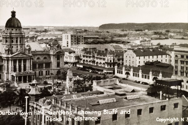 Durban town hall. View of Durban town hall and gardens looking across the city towards the bluff and docks in the distance. Durban, Natal (KwaZulu Natal), South Africa, circa 1936. Durban, KwaZulu Natal, South Africa, Southern Africa, Africa.