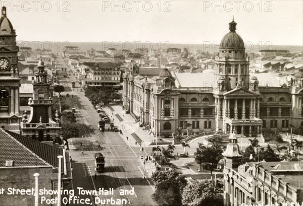 West Street, Durban. View along West Street towards the seafront, showing Durban's grandiose Town Hall building on the right. The clock tower belonging to the General Post Office building is also visible. Durban, Natal (KwaZulu Natal), South Africa, circa 1936. Durban, KwaZulu Natal, South Africa, Southern Africa, Africa.