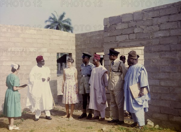 Governor Fadahunsi visits a Church of Nigeria hospital. Sir Chief Joseph Odeleye Fadahunsi (b.1901), Governor of Western Nigeria from December 1962 to January 1966, visits the construction site of a new ward at a Church of Nigeria hospital. Nigeria, November 1963. Nigeria, Western Africa, Africa.