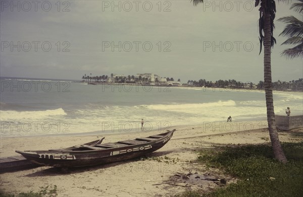 View towards Elmina Castle. View from a beach towards Elmina Castle across the bay. Elmina, Ghana, circa 1965. Elmina, Central (Ghana), Ghana, Western Africa, Africa.
