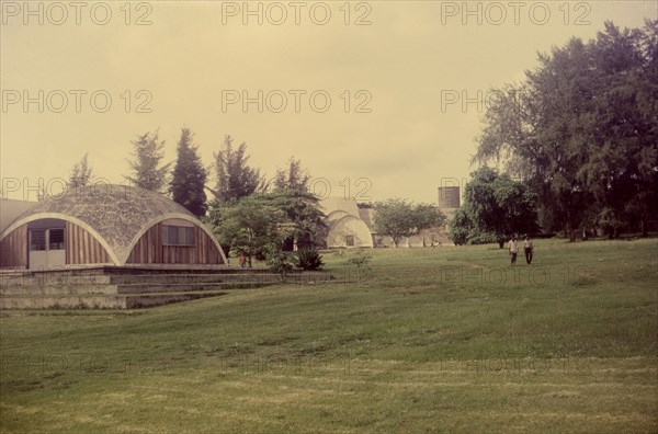 Muslim praying ground, Nigeria. A large open space in the university grounds provides a praying area for Muslim students and staff. The domed building to the left is a mosque. Nigeria, circa 1972. Nigeria, Western Africa, Africa.