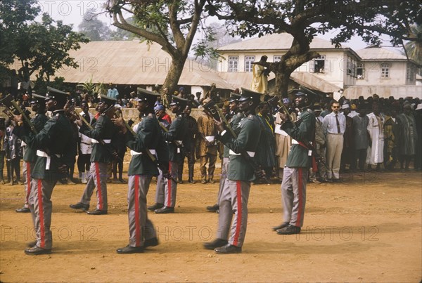 Fajuyi's state funeral. A group of uniformed military men parade with guns at the state funeral of Lieutenant Colonel Francis Adekunle Fajuyi. Ado Ekiti, Nigeria, 1966. Ado Ekiti, Ekiti, Nigeria, Western Africa, Africa.