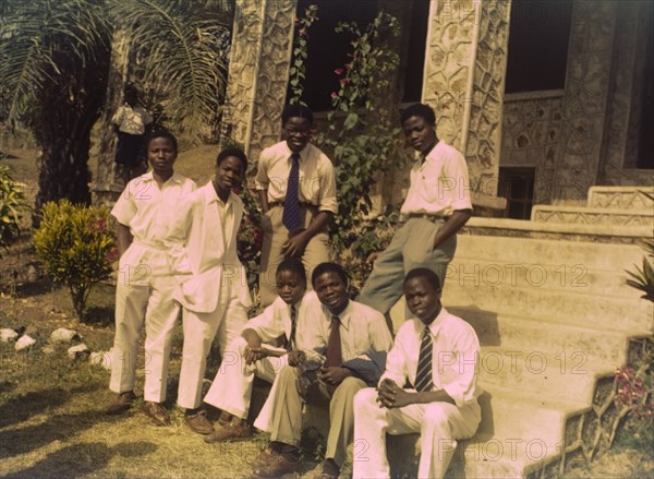 Church of Nigeria prefects. A group of smartly dressed prefects sit on the steps outside a Church of Nigeria school. Nigeria, circa 1963. Nigeria, Western Africa, Africa.