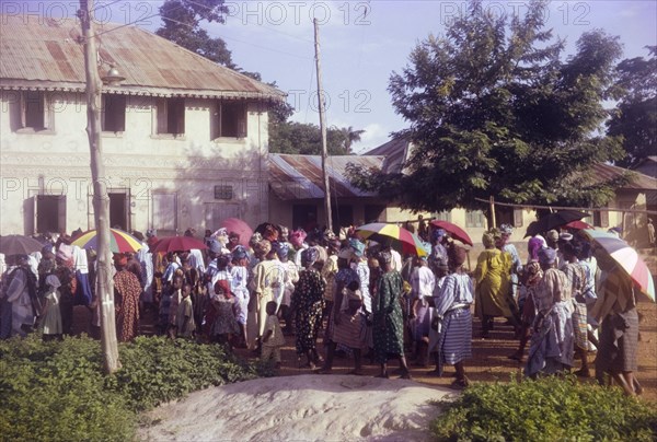 Nigerian outreach procession. A Church of Nigeria congregation from Ijero passes through town during a colourful outreach procession. Ijero, Nigeria, circa 1972. Ijero, Ogun, Nigeria, Western Africa, Africa.