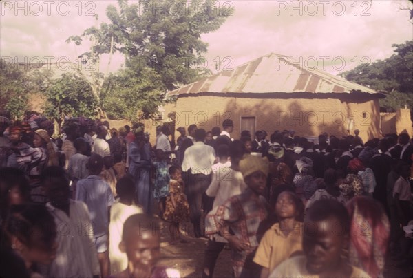 Nigerian outreach procession. A Church of Nigeria congregation from Asi gathers outdoors for an outreach procession. Asi, Nigeria, circa 1970. Asi, Oyo, Nigeria, Western Africa, Africa.