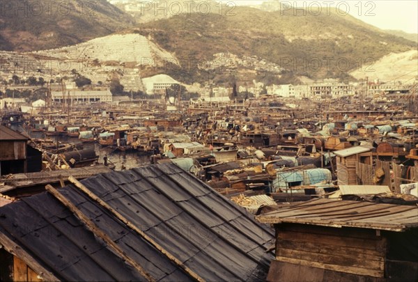 Sampan city. Hundreds of sampans moored in Aberdeen Bay, cram together, filling every available inch of water. Aberdeen, Hong Kong, People's Republic of China, January 1961. Aberdeen, Hong Kong, China, People's Republic of, Eastern Asia, Asia.