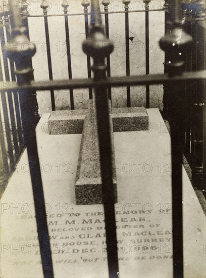 Tombstone of Sir Harry McLean's sister. View through railings of the Christian tombstone of General Sir Harry MacLean's sister. MacLean (1848-1920) was a Scottish soldier and an instructor to the Moroccan Army. Casablanca, Morocco, 1898. Casablanca, Casablanca, Morocco, Northern Africa, Africa.