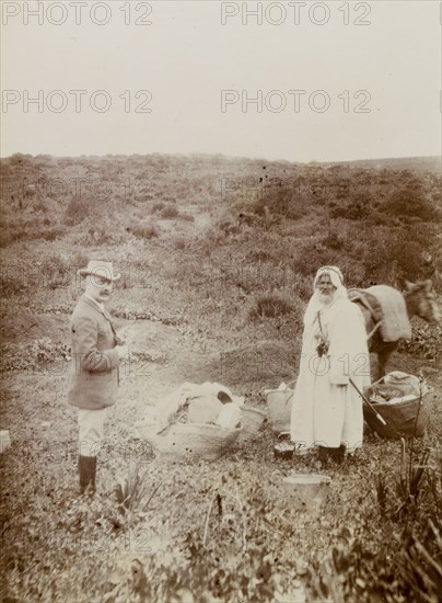 European excursion, Morocco. A European man identified as 'Hunter', talks with his local guide or porter on an excursion to archaeological ruins. Morocco, 1898. Morocco, Northern Africa, Africa.