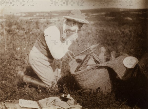 Outdoor shave, Morocco. A European man, probably Frederick Stanbury, shaves himself in an open field. Morocco, 1898. Morocco, Northern Africa, Africa.