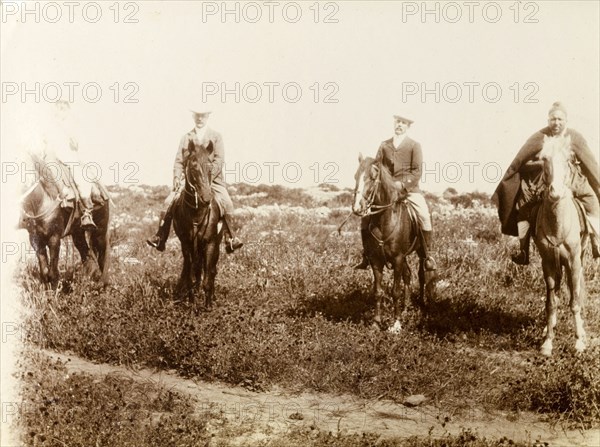 Four horsemen, Morocco. Portrait of four men on horseback. The two central figures are certainly European, one of whom is identified as 'Russi'. Morocco, 1898. Morocco, Northern Africa, Africa.