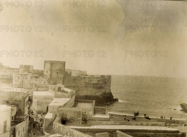 General view of Safi. View towards the coast of the square-shaped buildings and fortified walls of Safi. Safi, Morocco, 1898. Safi, Safi, Morocco, Northern Africa, Africa.