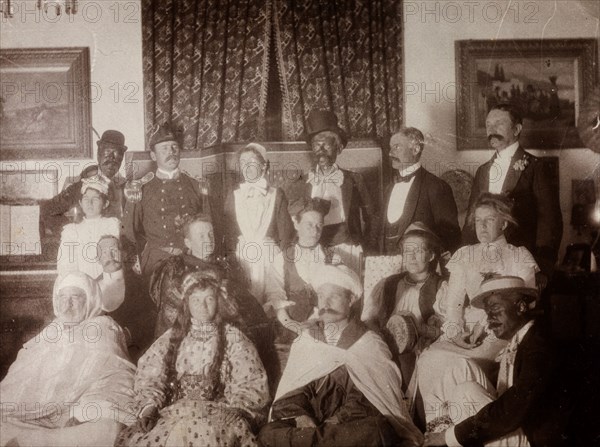 European fancy dress party, Morocco. Interior shot of European men and women dressed up in variety of Oriental and 'blacked-up' costumes. Safi, Morocco, 1898. Safi, Safi, Morocco, Northern Africa, Africa.