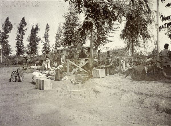 Frederick Stanbury's porters. Frederick Stanbury's safari porters wait by a roadside with numerous bundles of luggage strewn around them. British East Africa (Kenya), 1906. Kenya, Eastern Africa, Africa.