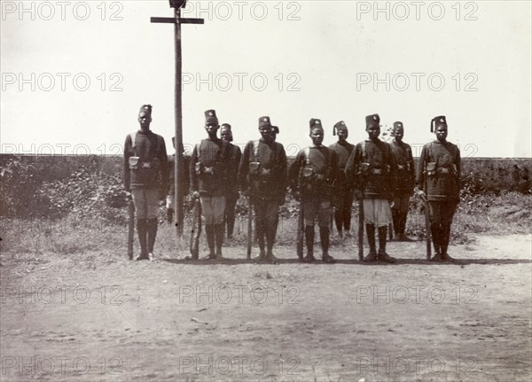 Askari escort on safari. A group of uniformed askaris (soldiers) provide an escort for Frederick Stanbury's hunting party on safari near Lake Baringo. British East Africa (Kenya), 1906. Kenya, Eastern Africa, Africa.