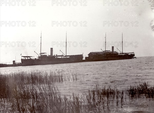 Lake steamers on Lake Victoria. The masts and funnels of two large lake steamers are silhouetted against the sky. Lake Victoria, British East Africa (Kenya), 1906., Nyanza, Kenya, Eastern Africa, Africa.