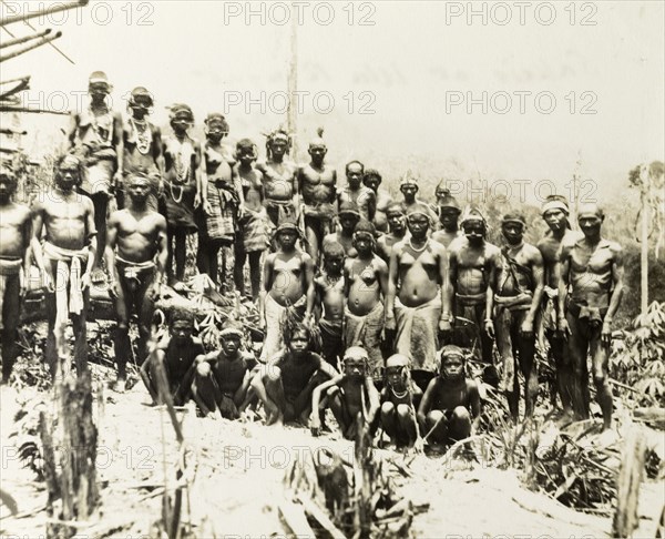 North Malaysian aborigines. Portrait of a large group of Malaysian aborigines at Ula Ringat. Semi-naked, their bodies are decorated with jewellery and wreaths of leaves that adorn their heads. Upper Perak, British Malaya (Malaysia), 1900., Perak, Malaysia, South East Asia, Asia.