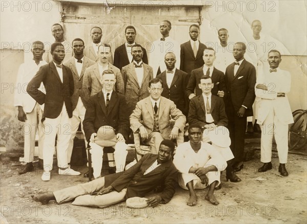 Staff of the African Oil Nuts Company. Group portrait of European and African staff of the African Oil Nuts Company. Lagos, Nigeria, 18 May 1921. Lagos, Lagos, Nigeria, Western Africa, Africa.