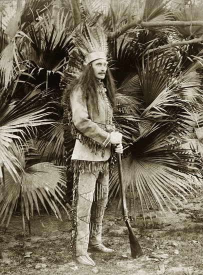 Mr Sitwell in fancy dress. S. A. H. Sitwell, a British employee of the Bank of Bengal, poses in fancy dress as a native American chief. Probably Kolkata, India, circa 1905. India, Southern Asia, Asia.