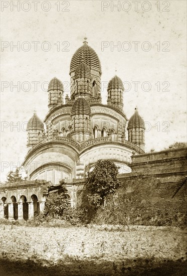 The Dakshineshwar Temple. The Dakshineshwar temple at Kali Ghat, adorned with nine 'chhatris' (cenotaphs), each capped with a beehive-shaped dome. Kali Ghat, India, circa 1905. Kali Ghat, West Bengal, India, Southern Asia, Asia.