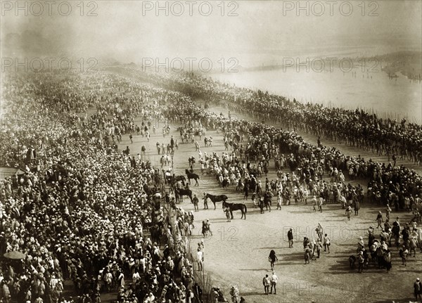 Kumbh Mela, Allahabad. Overhead view of the procession of fakirs, or Hindu holy men, at the Kumbh Mela. Allahabad, United Provinces (Uttar Pradesh), India, circa January 1906. Allahabad, Uttar Pradesh, India, Southern Asia, Asia.