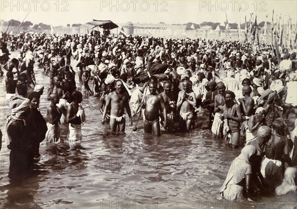 Pilgrims bathing at the Kumbh Mela. Hindu pilgrims and fakirs, or holy men, bathing at the Kumbh Mela. Allahabad, United Provinces (Uttar Pradesh), India, circa January 1906. Allahabad, Uttar Pradesh, India, Southern Asia, Asia.