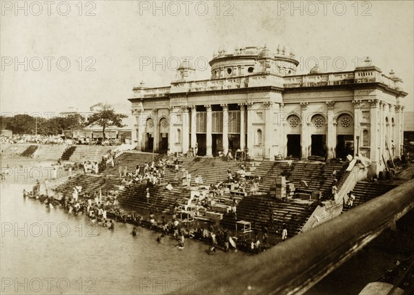 Bathing ghat on the Hooghly River. Hindu devotees bathe at a ghat (stepped wharf) on the banks of the Hooghly River. Calcutta (Kolkata), India, circa 1895. Kolkata, West Bengal, India, Southern Asia, Asia.