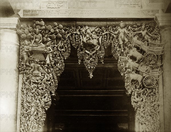 Wood carving at Shwe Dagon Pagoda. Detail of an elaborate wood carving at the main entrance to the Buddist temple of Shwe Dagon Pagoda. Rangoon (Yangon), Burma (Myanmar), circa 1885. Yangon, Yangon, Burma (Myanmar), South East Asia, Asia.