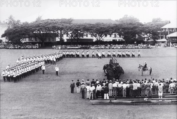 King George VI's birthday parade, Guyana. Uniformed police officers, some mounted on horseback, perform a march at the Eve Leary parade ground on the occasion of King George VI's birthday. Georgetown, Guyana, 14 December 1948. Georgetown, Demerara-Mahaica, Guyana, South America, South America .