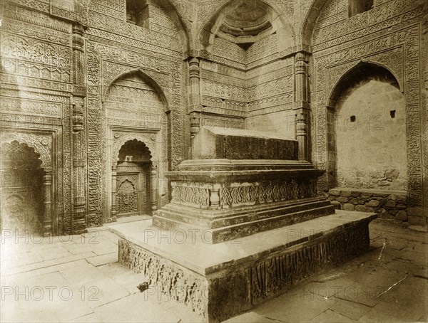 Tomb at Qutb Minar, Delhi. Intricately carved stone walls surround a tomb located inside the Qutb Minar. Delhi, India, circa 1885. Delhi, Delhi, India, Southern Asia, Asia.