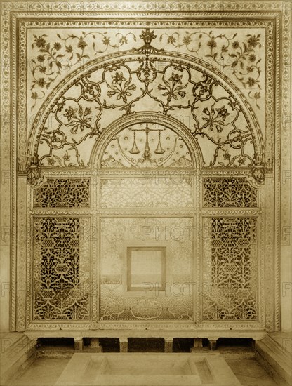 Scales of Justice' screen. An intricately carved marble screen in the Khas Mahal. The semi-circular panel of the screen depicts a crescent moon, stars and the scales of justice, the latter used as a regal emblem. The lower section is carved in a floral and lattice work design. Delhi, India, circa 1885. Delhi, Delhi, India, Southern Asia, Asia.