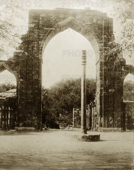 The Iron Pillar at Qutb, circa 1885. The Iron Pillar stands before the ruins of Quwwat-ul-Islam Mosque. Like the nearby Ashoka Pillar ('Singh Stambh'), with which it is often confused, the Iron Pillar was erected in around 400AD and has remained mysteriously uncorroded for hundreds of years. Delhi, India, circa 1885. Delhi, Delhi, India, Southern Asia, Asia.