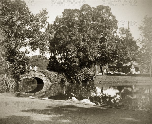 Burmese pagoda in the Eden Gardens. Two people chat on a footbridge leading to the Burmese pagoda in the Eden Gardens. Calcutta (Kolkata), India, circa 1890. Kolkata, West Bengal, India, Southern Asia, Asia.